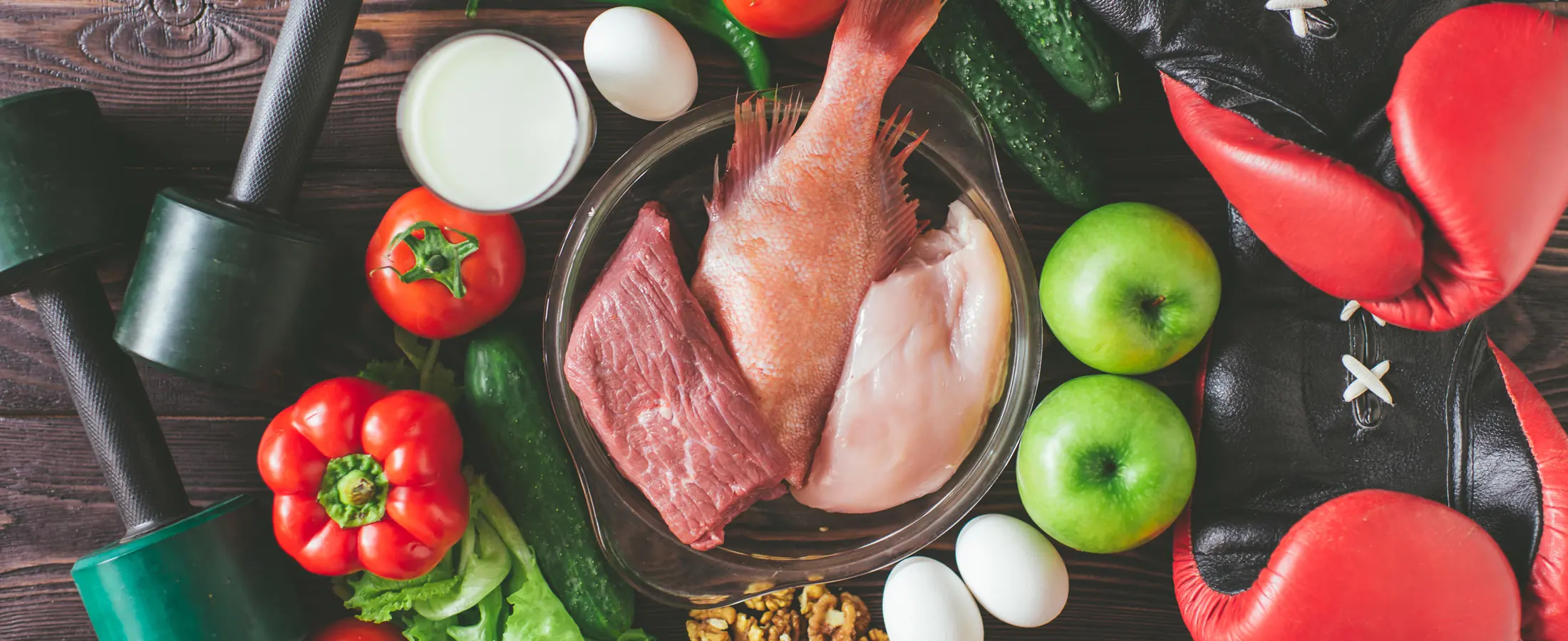 Training equipment laid out beside raw protein, eggs and fresh produce